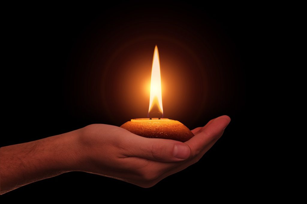 hand, candle, diwali-4543318.jpg